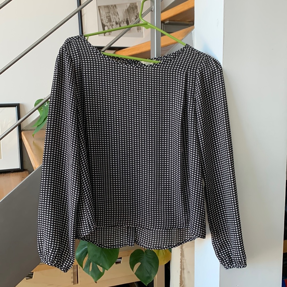 Silky blouse. Worn once. Button up back. Black and white pattern. Cuffed sleeves